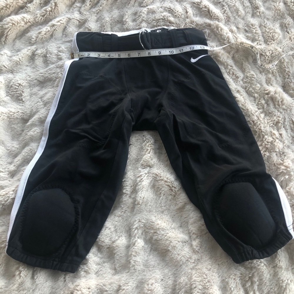 Nike Men’s padded football pants.